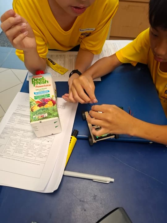 A student assembling a build during a Code Gakko programme