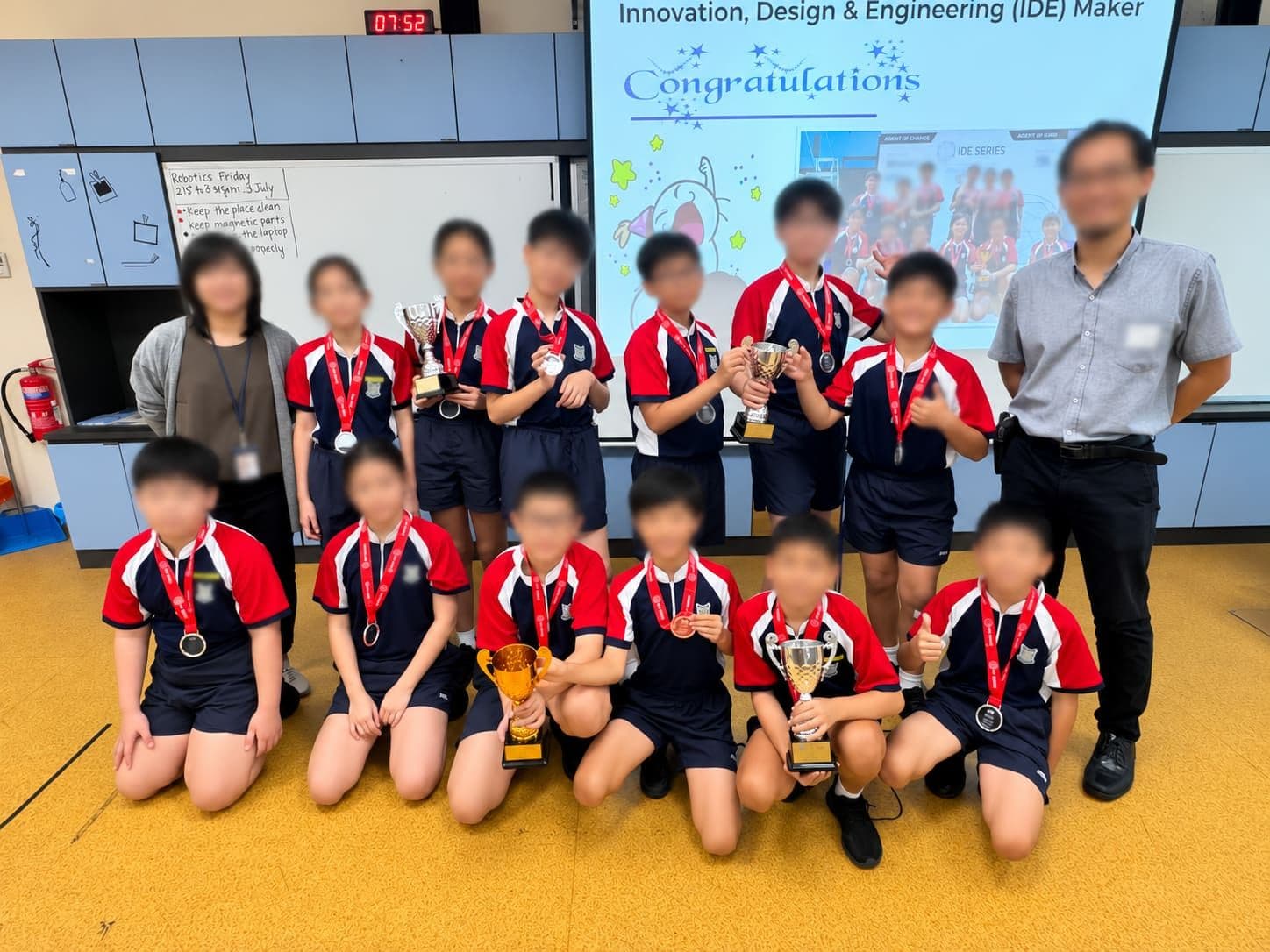 New Town Primary School robotics teams with their trophies and medals after the IDE Maker 2026 finals