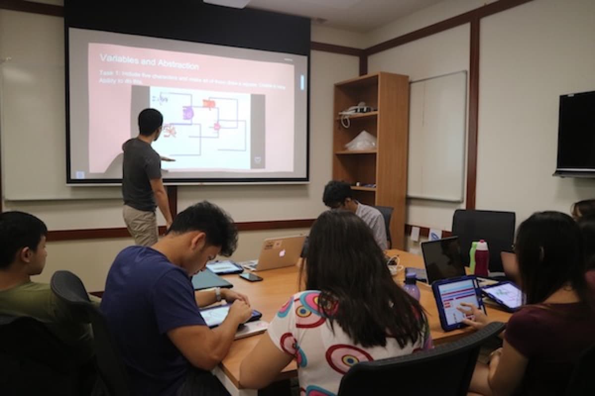 Code Gakko instructors during a training session