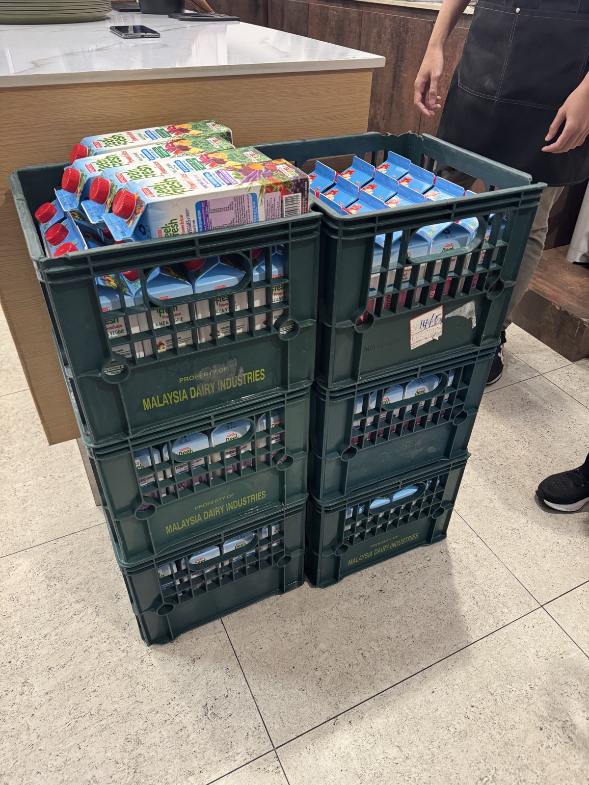 Crates of donated 946ml juice cartons delivered to AMGD.