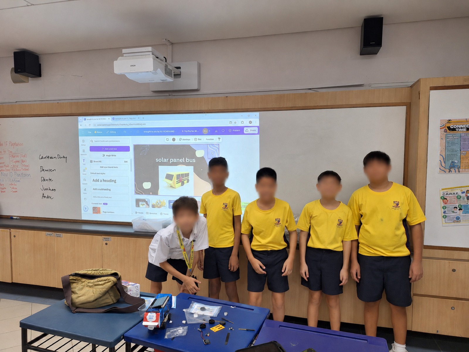 A team presenting their solar panel bus design to the class.